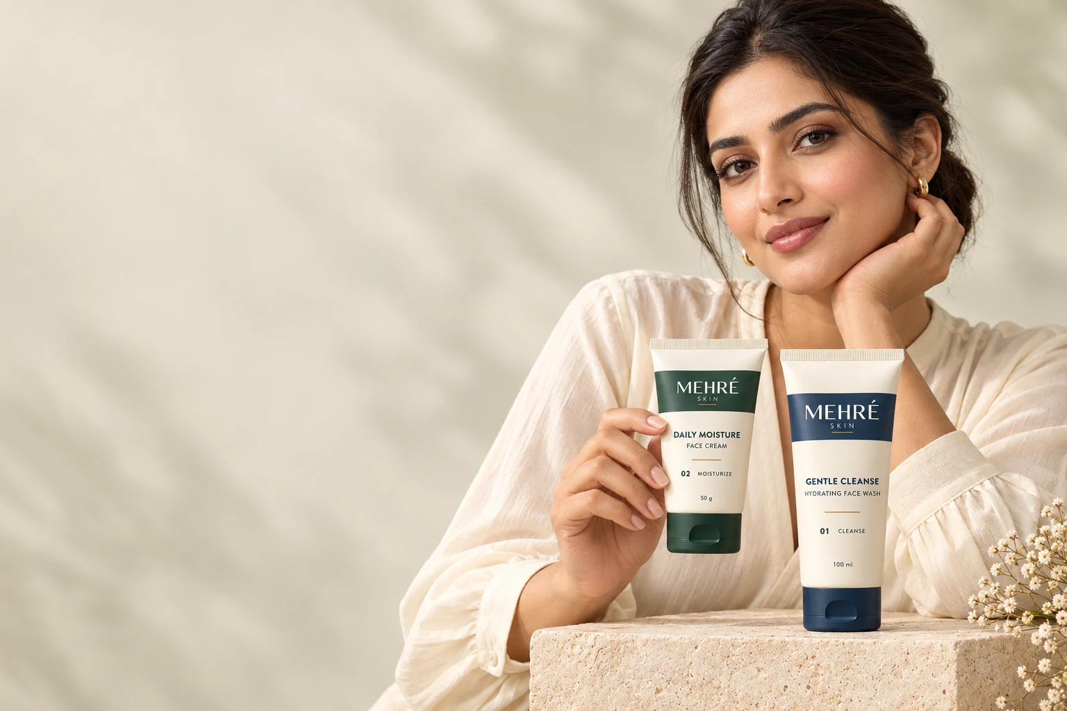 MEHRÉ SKIN campaign model holding Daily Moisture beside Gentle Cleanse